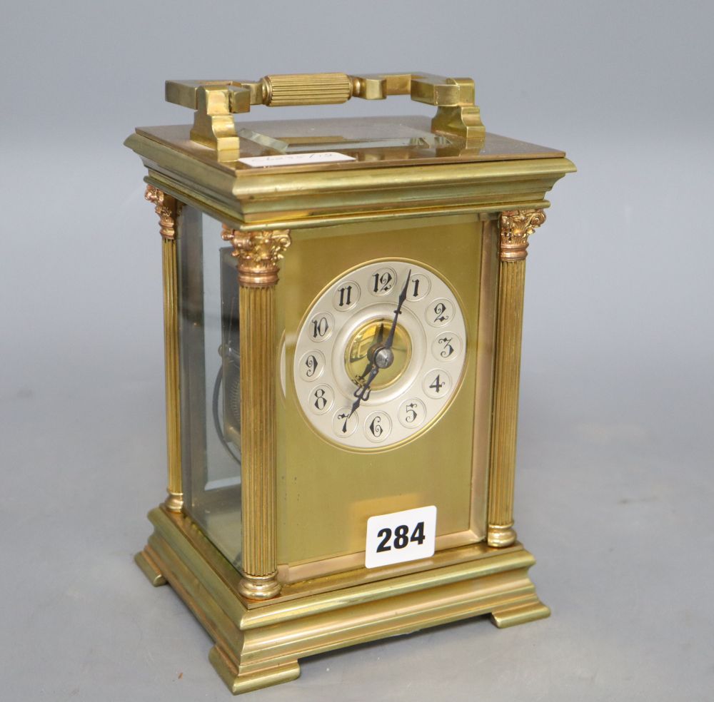 An early 20th century French lacquered brass oversized carriage clock, striking on a gong, movement by Japy Freres four glass mantel cl